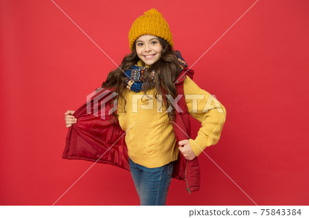 cheerful child girl with long hair and warm clothing, winter style cheerful child girl with long hair and warm clothing, winter style 75843384