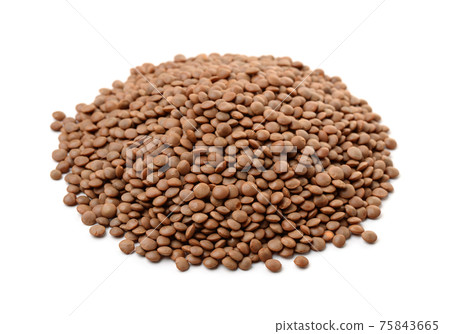Pile of dry brown lentils 75843665