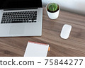 Office at home. LaptOffice at home. Laptop. notebook. pen are on the table.op. notebook. pen are on the table. 75844277