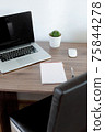 Office at home. LaptOffice at home. Laptop. notebook. pen are on the table.op. notebook. pen are on the table. 75844278