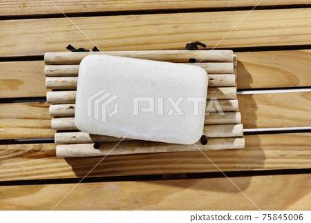 Bar of soap on wooden table Bar of soap on wooden table 75845006