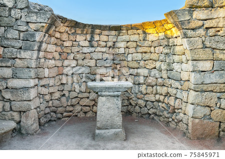 Stone wall with an altar in the archaeological museum of Chersonese - national historical and archaeological reserve. Stone wall with an altar in the archaeological museum of Chersonese - national historical and archaeological reserve. 75845971