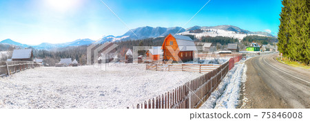 Fantastic winter landscape with wooden houses in snowy mountains. 75846008
