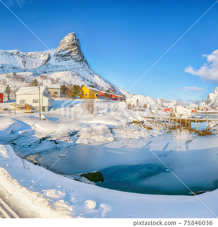 Fabulous winter sunny view on Hammarskaftet Mountain Peak with footbridge above Gravdalbukta bay 75846036
