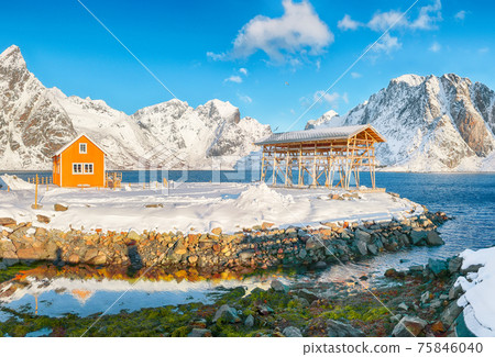 Breathtaking winter view of Sakrisoy village and snowy mountaines on background. 75846040