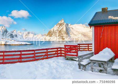 Traditional Norwegian red wooden houses on the shore of  Reinefjorden in Hamnoy villa 75846098