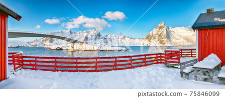 Fantastic winter view on Hamnoy village and bridge to Olenilsoya island. 75846099