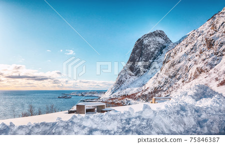 Fabulous winter view of Hamnoy village with Festheltinden peak seen from Akkarvikodden Reststop Fabulous winter view of Hamnoy village with Festheltinden peak seen from Akkarvikodden Reststop 75846387