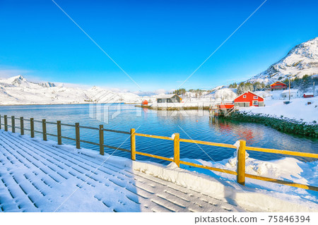 Captivating winter view of  fishing village on Sundstraumen strait 75846394