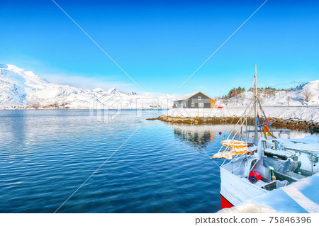 Captivating winter view of fishing village on Sundstraumen strait Captivating winter view of fishing village on Sundstraumen strait 75846396