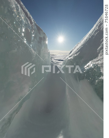 Ice slopes in sunny winter day, transparent ice of blue color, purely blue sky, long shadows, a pure snow-covered virgin soil, snow barkhans, Ice slopes in sunny winter day, transparent ice of blue color, purely blue sky, long shadows, a pure snow-covered virgin soil, snow barkhans, 75846728