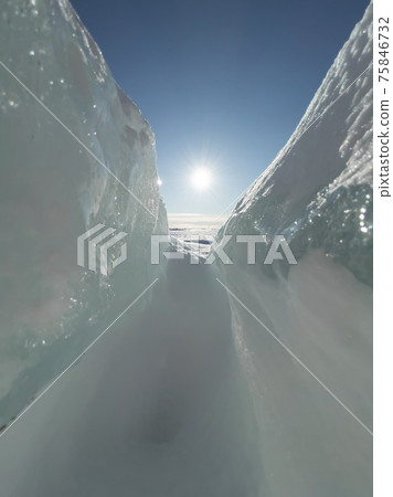 Ice slopes in sunny winter day, transparent ice of blue color, purely blue sky, long shadows, a pure snow-covered virgin soil, snow barkhans, Ice slopes in sunny winter day, transparent ice of blue color, purely blue sky, long shadows, a pure snow-covered virgin soil, snow barkhans, 75846732