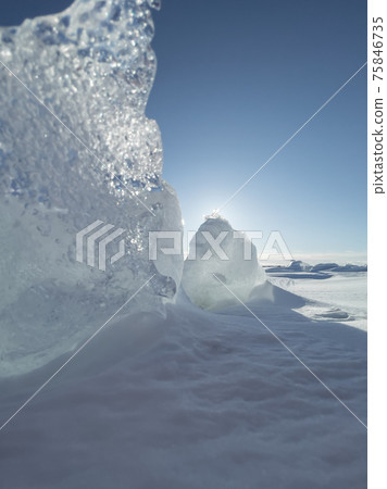 Ice slopes in sunny winter day, transparent ice of blue color, purely blue sky, long shadows, a pure snow-covered virgin soil, snow barkhans, Ice slopes in sunny winter day, transparent ice of blue color, purely blue sky, long shadows, a pure snow-covered virgin soil, snow barkhans, 75846735