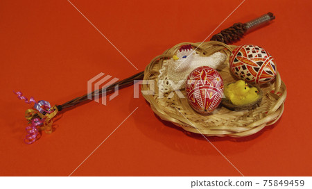 Czech rod with differently colored Easter eggs, red background 75849459