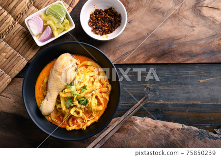Northern Thai food (Khao Soi), Spicy curry noodles soup with chicken Northern Thai food (Khao Soi), Spicy curry noodles soup with chicken 75850239