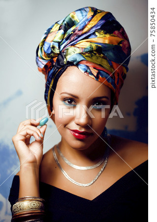 beauty bright african woman with creative make up, shawl on head like cubian closeup smiling beauty bright african woman with creative make up, shawl on head like cubian closeup smiling 75850434
