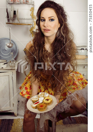 crazy real woman housewife on kitchen, eating perfoming, bizare girl crazy real woman housewife on kitchen, eating perfoming, bizare girl 75850455