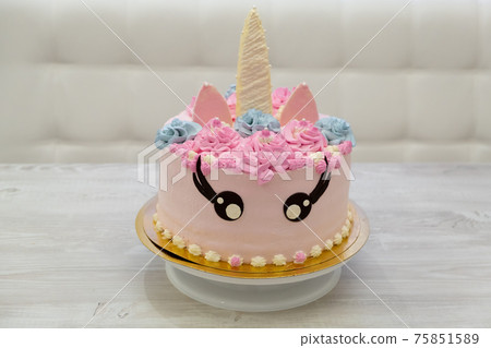 birthday cake in the form of a pink unicorn cat. Sweet cute cake 75851589
