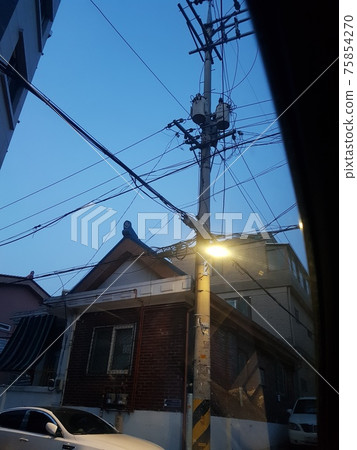 Spring. Alley. Forsythia. Old house Spring. Alley. Forsythia. Old house 75854270