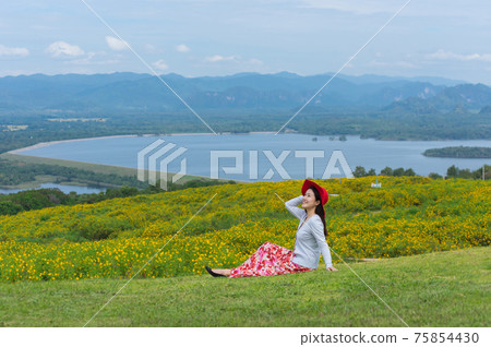 Beautiful woman in nature flower. 75854430