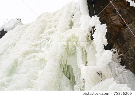 Frozen waterfall from a stone cliff in the national park. Frozen waterfall from a stone cliff in the national park. 75856209