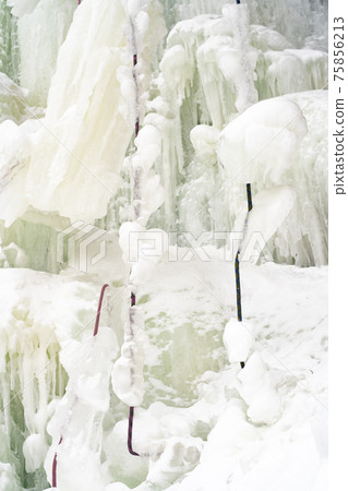 Frozen waterfall from a stone cliff in the national park. Frozen waterfall from a stone cliff in the national park. 75856213