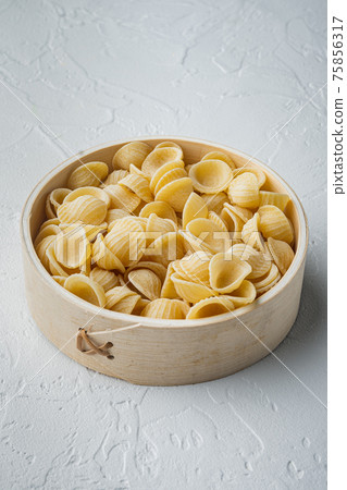 Durum wheat semolina pasta bowl, on white background Durum wheat semolina pasta bowl, on white background 75856317