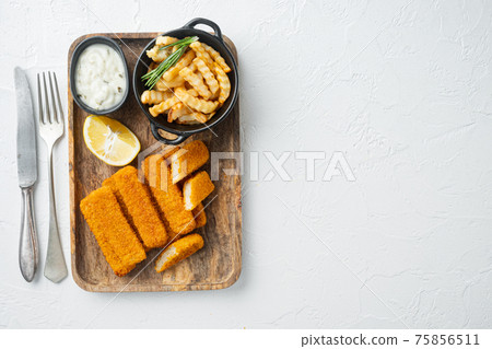 Pile of golden fried fish fingers with white garlic sauce, on wooden tray, on white background, top view flat lay , with copyspace and space for text 75856511