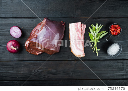 Raw liver with bacon and onion on black wooden background, flat lay Raw liver with bacon and onion on black wooden background, flat lay 75856570