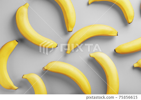 Bright pattern of yellow bananas on a gray background fashionable colors of 2021 75856615