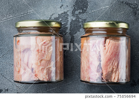 Tuna fillet canned, on gray background, top view Tuna fillet canned, on gray background, top view 75856694