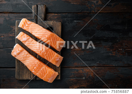 Raw salmon fillets, on old wooden table, flat lay with space for text 75856887