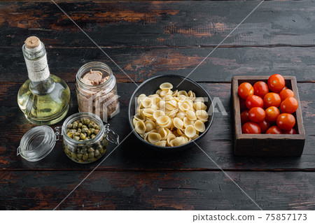 Tuna pasta shells ingredients, on dark wooden background 75857173