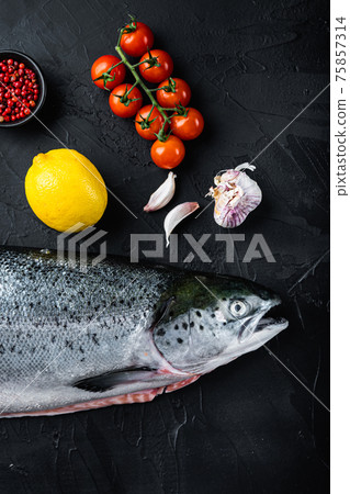 Fresh rainbow trout on black background, flat lay 75857314