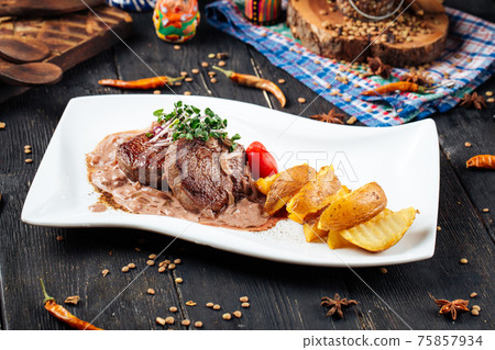 Fillet mignon steaks mushroom sauce with potatoes Fillet mignon steaks mushroom sauce with potatoes 75857934