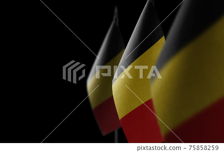 Small national flags of the Belgium on a black background Small national flags of the Belgium on a black background 75858259