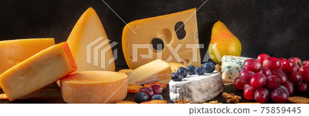 Cheese variety panorama on a black background Cheese variety panorama on a black background 75859445
