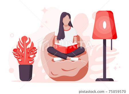 Young woman sitting cross-legged and read book. 75859570