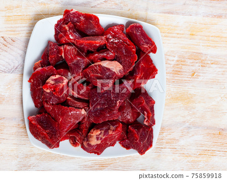 Raw beef prepared for stewing Raw beef prepared for stewing 75859918