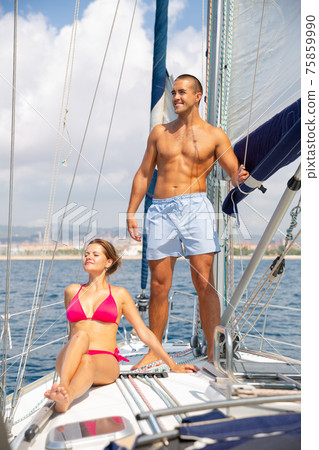 Couple enjoying sea trip along coast of Barcelona 75859990