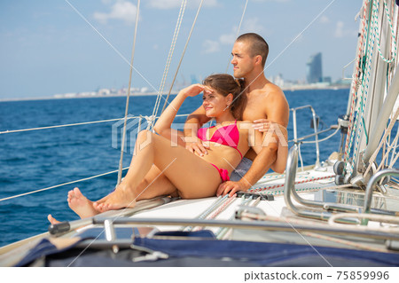 Couple enjoying sea trip along coast of Barcelona 75859996