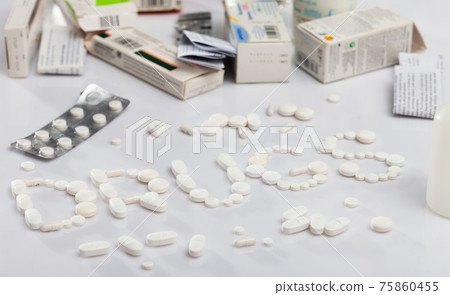 Many different pills and medical capsules close up Many different pills and medical capsules close up 75860455