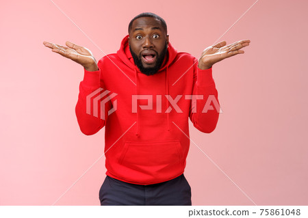 Excited passionate emotive african-american male discussing shocking match moment retelling amusing story cannot get clue how team lost shrugging hands spread sideways dismay look confused 75861048