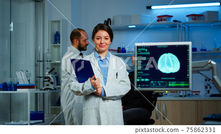 Portrait of scientist neurologist researcher looking at camera smiling Portrait of scientist neurologist researcher looking at camera smiling 75862331
