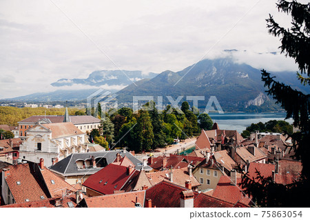 Annecy city top view, lake in the distance. Tile roofs, Cathedral 75863054