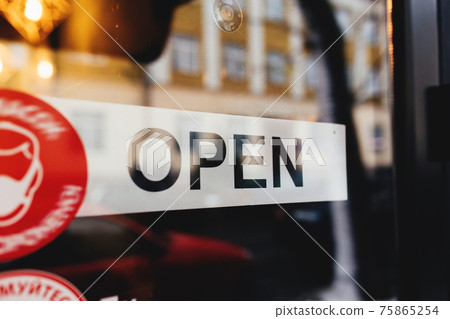 Signboard with Open text at the cafe through glass window Signboard with Open text at the cafe through glass window 75865254