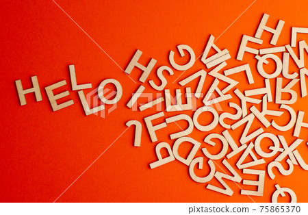 wooden cut alphabet letters on orange background spelling the word hello wooden cut alphabet letters on orange background spelling the word hello 75865370