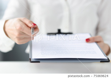 Business woman giving document on clipboard for signature closeup 75869624
