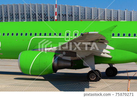 Close up of passenger airplane parked in airport 75870271
