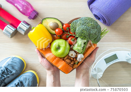 Ketogenic diet healthy lifestyle on eating clean keto food good health dietary in heart dish with aerobic body exercise, gym workout training class , weight scale and sports shoes in fitness center Ketogenic diet healthy lifestyle on eating clean keto food good health dietary in heart dish with aerobic body exercise, gym workout training class , weight scale and sports shoes in fitness center 75870503